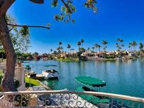 Stunning water view with boats and lush landscaping at 10120 E Topaz Dr, Scottsdale, AZ 85258