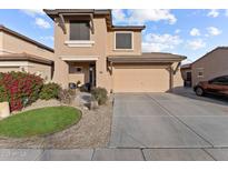 Two-story house with attached garage and landscaping at 11849 N 51St Dr, Glendale, AZ 85304