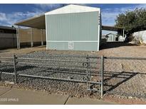 Mobile home with carport and fenced yard at 16634 N Queen Esther Dr, Surprise, AZ 85378