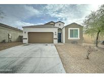 Charming single-story home with a two-car garage and low maintenance desert landscaping at 30263 W Pinchot Ave, Buckeye, AZ 85396