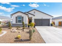 One-story home with desert landscaping and two-car garage at 3560 N Mia Ln, Casa Grande, AZ 85122