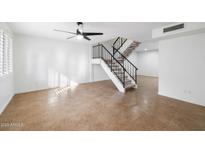 Bright living room with tile floors and staircase at 4316 N Parkway Ave, Scottsdale, AZ 85251