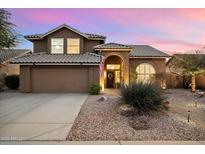 Beautiful two-story home with landscaped yard and a three-car garage at 4330 N Ranier Cir, Mesa, AZ 85215