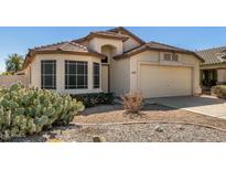 Charming single-story home with desert landscaping, a front-facing garage and neutral color scheme at 4383 E Coal St, San Tan Valley, AZ 85143