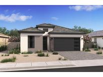 Single-story home with modern facade, attached garage, and desert landscaping at 4404 N 203Rd Dr, Buckeye, AZ 85396