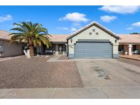 Charming single-story home featuring a low maintenance front yard, mature palm tree, and two-car garage at 480 E Bart Dr, Chandler, AZ 85225