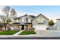 Beautiful two-story home featuring manicured lawn and covered porch at 5344 E Catalina Ave, Mesa, AZ 85206