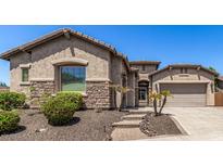 One-story home with stone accents and a landscaped front yard at 5612 W Alyssa Ln, Phoenix, AZ 85083