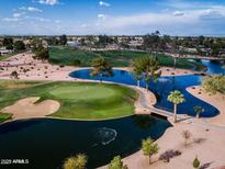 Stunning aerial view of a lush golf course with water features in a beautiful community at 9725 E Navajo Pl, Sun Lakes, AZ 85248