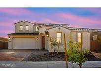 Stunning two-story home with a charming facade and landscaped front yard at 16917 W Jenan Dr, Surprise, AZ 85388