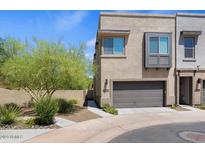 Modern two-story home with attached garage and desert landscaping at 23393 N 73Rd Way, Scottsdale, AZ 85255