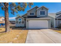 Charming two-story home with attached two-car garage and nicely maintained front yard at 235 N 22Nd Pl # 565, Mesa, AZ 85213