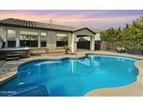 Inviting pool with a spa and lush landscaping at 28107 N 123Rd Ln, Peoria, AZ 85383