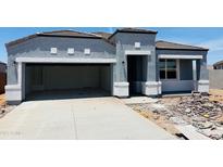 Charming single-story home featuring a two-car garage, and modern architectural details at 28242 N Nealite Dr, San Tan Valley, AZ 85143