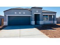 Charming single-story home featuring a two-car garage and a well-manicured front yard at 28242 N Nealite Dr, San Tan Valley, AZ 85143