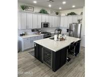 Spacious kitchen featuring a large island, stainless steel appliances, and ample cabinetry at 3036 E Boston St, Gilbert, AZ 85295