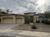 Single-story home with desert landscaping and a two-car garage at 16389 N 108Th Pl, Scottsdale, AZ 85255