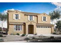 Two-story house with beige exterior, white trim, and a two-car garage at 24224 W Agora Ln, Buckeye, AZ 85326