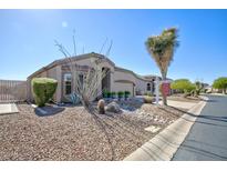 Charming home with desert landscaping, mature plants, and inviting curb appeal under a clear blue sky at 3055 N Red Mtn # 156, Mesa, AZ 85207