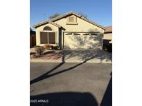 Charming single-story home with a two-car garage, low maintenance yard, and neutral color palette at 4004 E Chambers St, Phoenix, AZ 85040