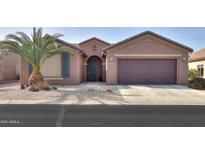 Single-story home with desert landscaping and a two-car garage at 5181 W Buckskin Dr, Eloy, AZ 85131