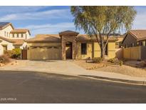 Single-story home with a two-car garage and landscaped front yard at 6238 W Buckhorn Trl, Phoenix, AZ 85083