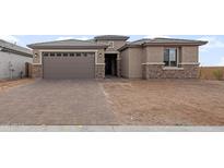 One-story home with a two-car garage and a brick facade at 7163 W Oberlin Way, Peoria, AZ 85383