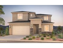 Two-story house with beige exterior, stone accents, and landscaped front yard at 18172 E Tiffany Dr, Queen Creek, AZ 85142