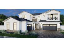 Two-story home with white exterior, gray garage doors, and brick accents at 2538 E Preston St, Mesa, AZ 85213