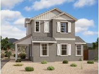 Two-story home with gray siding, white accents, and a covered porch at 26021 N 23Rd Ave, Phoenix, AZ 85085