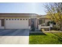 Single-story home with attached two-car garage and landscaped front yard at 2663 S Springwood Blvd # 299, Mesa, AZ 85209