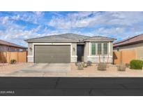 Charming single-story home featuring a two-car garage and desert landscaping at 346 E Tahiti E Dr, Casa Grande, AZ 85122