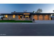 Stunning single-story home with a 3-car garage and a well-manicured front yard at 3643 E Coolidge St, Phoenix, AZ 85018