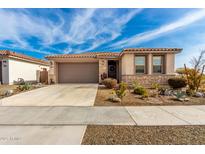 Single-story home with desert landscaping and a two-car garage at 15047 S 178Th Dr, Goodyear, AZ 85338