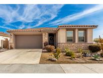 Single-story home with desert landscaping and a two-car garage at 15047 S 178Th Dr, Goodyear, AZ 85338
