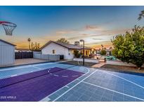 Large backyard with sport court, pool, and patio, perfect for outdoor entertainment at 5112 E Voltaire Ave, Scottsdale, AZ 85254