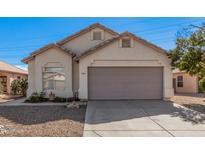 Single-story house with a two-car garage and desert landscaping at 1085 W Dava Dr, Tempe, AZ 85283