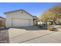 Single-story house with a two-car garage and desert landscaping at 15034 N 30Th St, Phoenix, AZ 85032