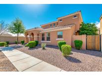 Two-story house with landscaped front yard, walkway, and neutral color scheme at 1777 S Balboa Dr, Gilbert, AZ 85295