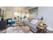 Bright living room featuring a comfy sofa and stylish coffee tables at 180 S Stardust Ln, Apache Junction, AZ 85120