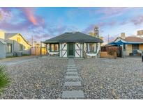 House exterior showcasing a stone facade and a gravel pathway at 1921 W Monte Vista Rd, Phoenix, AZ 85009