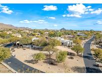 Aerial view of a luxurious home with a pool and landscaped grounds at 12129 N 114Th Way, Scottsdale, AZ 85259