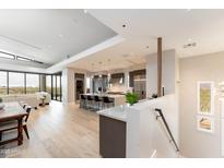Bright, modern kitchen with a large island, stainless steel appliances, and an open floor plan at 37200 N Cave Creek Rd # 2127, Scottsdale, AZ 85262