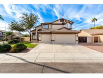 Two-story house with a two-car garage and well-manicured lawn at 3840 S Nebraska St, Chandler, AZ 85248
