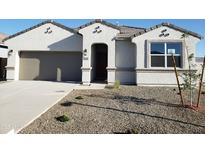 Charming single-story home featuring a stucco facade, desert landscaping, and an attached two-car garage at 48453 N Duran Way, Gold Canyon, AZ 85118