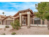 Charming single-story home with a landscaped front yard, covered entryway, and a two-car garage at 532 S Lagoon Dr, Gilbert, AZ 85233