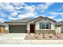 Charming single-story home with a well-manicured front yard, a garage, and a lovely front door at 8470 W Mantle Way, Florence, AZ 85132