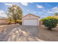 House exterior featuring a garage and well-maintained front yard at 15145 W Elko Dr, Surprise, AZ 85374