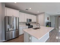 Modern kitchen with stainless steel appliances and an island at 1631 E Paul Dr, Casa Grande, AZ 85122