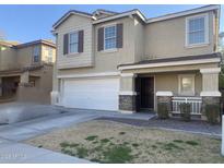 Charming two-story home with a two-car garage and well-maintained lawn at 2113 E Sunland Ave, Phoenix, AZ 85040